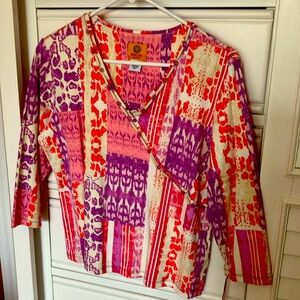 Brand new with tags, coral, off-white, and purple colored casual top.